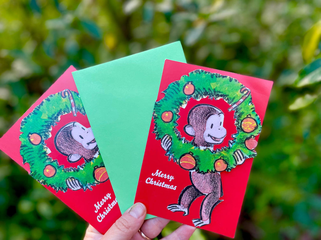 Curious George Christmas Card Boxed Funny Holiday Greeting Card with Monkey and Christmas Wreath It’s the Most Wonderful Time of the Year